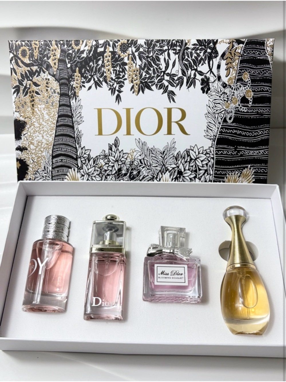 Dior Four-Piece Mini Perfume Set — Pink, Gold & Clear Bottles